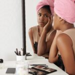 black-woman-watching-herself-mirror